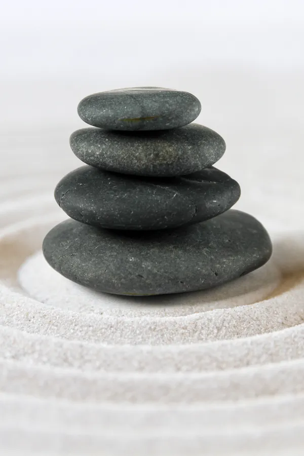 Ayurvedic-Spa-Treatment A stack of stones on rippled sand. Get ayurvedic massage therapy from Dr. Donna Diamond in Louisville/Boulder.