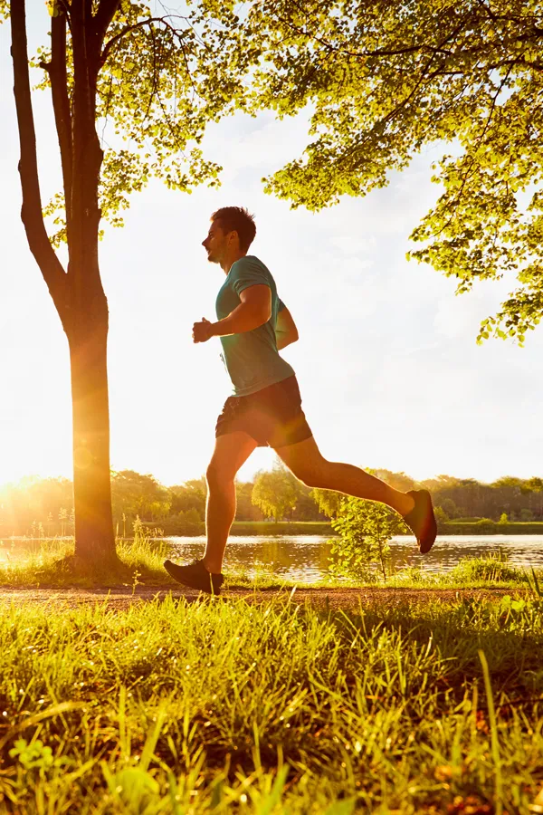 Cold-Laser-Therapy-Treatment A man runs on a sunny trail. Get cold laser therapy from Dr. Donna Diamond in Louisville/Boulder.