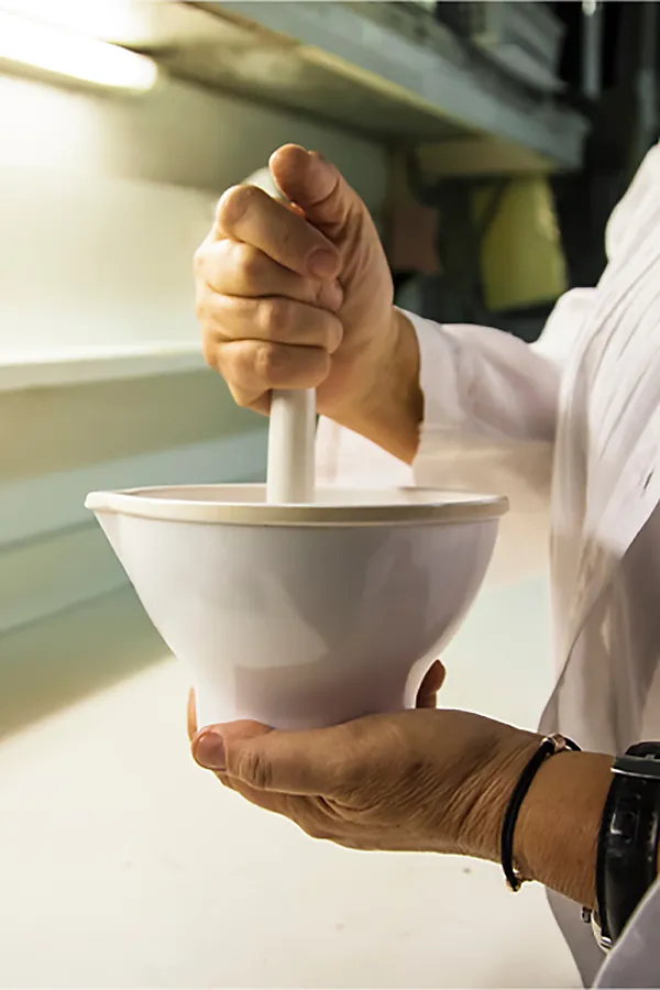 Compounding-Medicine-Treatment A woman using a mortar and pestle. Get compounding medicine treatment from Dr. Donna Diamond in Louisville/Boulder.