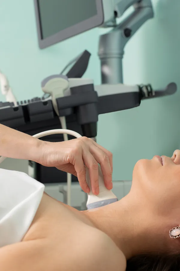 Hashimotos-Thyroiditis-Treatment A woman gets a thyroid scan from a doctor in a clinic. Get help with Hashimoto's Thyroiditis from Dr. Donna Diamond in Louisville/Boulder.