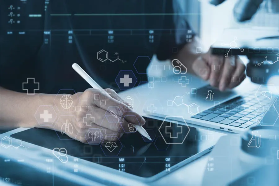 Health-Conditions-Treated-Doctor Close-up of a medical professional using a laptop and tablet, with illustrated medical symbols overlayed on the image, symbolizing health conditions treated by Dr. Donna Diamond in Louisville/Boulder.