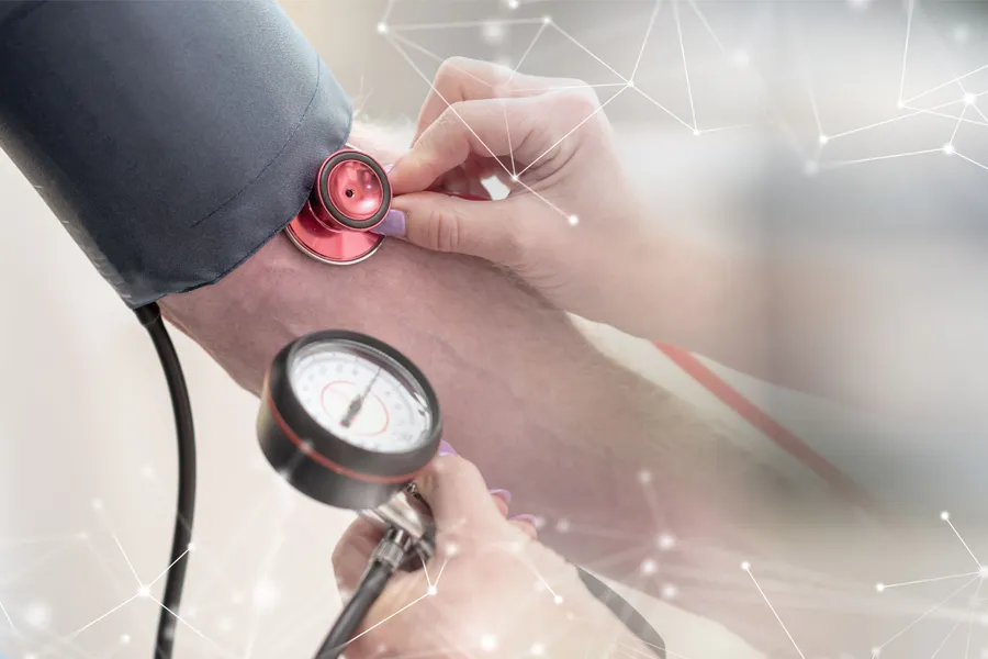 Hypertension-Clinic A man gets his blood pressure taken. Schedule hypertension treatment from Dr. Donna Diamond in Louisville/Boulder.