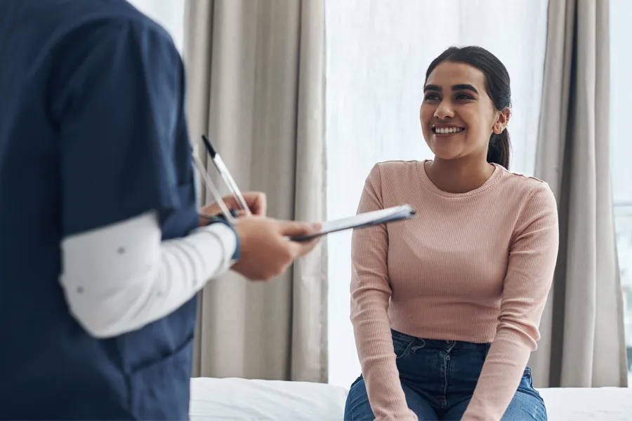 Immigration-Physical-Exam-Clinic A latina woman gets a physical exam. Get an immigration physical exam from Dr. Donna Diamond in Louisville/Boulder.