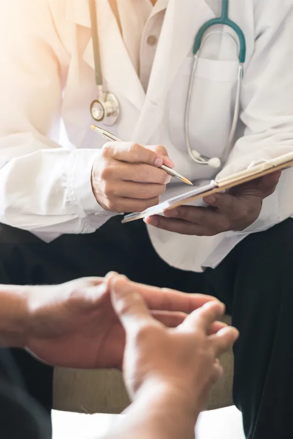 Immigration-Physical-Exam-Treatment A clinician goes over exam results with a patient. Get an immigration physical exam from Dr. Donna Diamond in Louisville/Boulder.