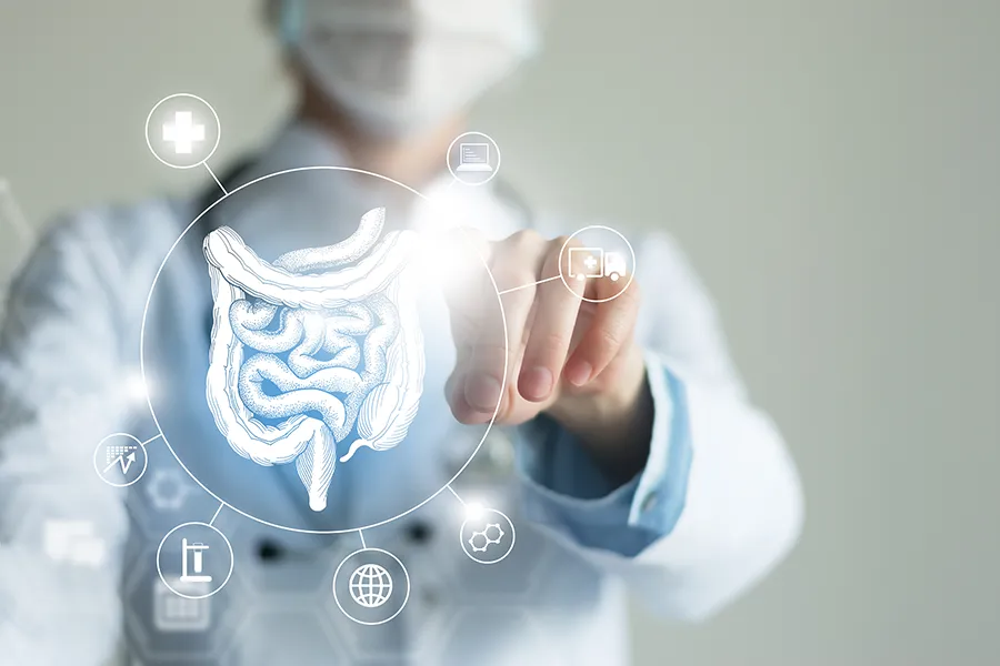 Leaky-Gut-Syndrome-Clinic Dr. Donna Diamond provides advanced Functional Medicine for Leaky Gut Syndrome treatments in Louisville/Boulder, shown by a doctor touching a glowing digital intestinal health display.