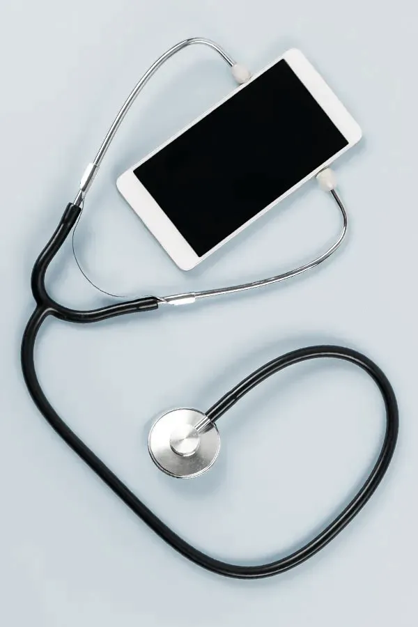 Telemedicine-Treatment A smartphone with a stethoscope attached to it, symbolizing Telemedicine treatment from Dr. Donna Diamond in Louisville/Boulder.
